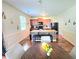 Open kitchen with a center island, wooden cabinets, and a dining area nearby at 171 Shaker Hollow Drive Dr, Mcdonough, GA 30253
