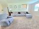 Comfortable living room with large sectional sofa, ideal for entertaining guests at 171 Shaker Hollow Drive Dr, Mcdonough, GA 30253