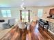 Inviting living space with hardwood floors that connects dining area and kitchen at 171 Shaker Hollow Drive Dr, Mcdonough, GA 30253