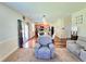 Bright and open living area with hardwood floors connecting to a modern kitchen at 171 Shaker Hollow Drive Dr, Mcdonough, GA 30253