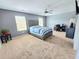 Spacious main bedroom with neutral carpet, ceiling fan, and ample natural light at 171 Shaker Hollow Drive Dr, Mcdonough, GA 30253
