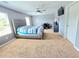 Spacious main bedroom with neutral carpet, ceiling fan, and ample natural light at 171 Shaker Hollow Drive Dr, Mcdonough, GA 30253