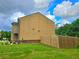 Side yard showing siding, green lawn and wooden fence at 171 Shaker Hollow Drive Dr, Mcdonough, GA 30253