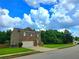 Two-story home featuring a brick facade, attached two-car garage, and a lush lawn at 171 Shaker Hollow Drive Dr, Mcdonough, GA 30253