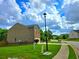 Two-story home featuring a brick facade, attached two-car garage, and a lush lawn at 171 Shaker Hollow Drive Dr, Mcdonough, GA 30253
