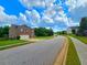 Two-story home featuring a brick facade, attached two-car garage, and a lush lawn at 171 Shaker Hollow Drive Dr, Mcdonough, GA 30253