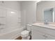 Clean bathroom featuring a tub shower combo and single sink vanity at 237 Arwen Drive Lot 61, Mcdonough, GA 30252
