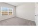 Carpeted bedroom with a window for natural light at 237 Arwen Drive Lot 61, Mcdonough, GA 30252
