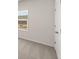 Bedroom with neutral carpet, large window and white trim at 237 Arwen Drive Lot 61, Mcdonough, GA 30252