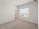 Cozy bedroom featuring neutral carpet and a window for natural light at 237 Arwen Drive Lot 61, Mcdonough, GA 30252