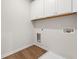 Laundry room with wooden floors and white cabinets at 237 Arwen Drive Lot 61, Mcdonough, GA 30252