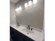 Bathroom with a dual sink vanity and modern black faucet fixtures at 970 Bibbs Circle Nw # 12, Atlanta, GA 30318