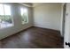 Bright bedroom features hardwood floors and large windows with neighborhood views at 970 Bibbs Circle Nw # 12, Atlanta, GA 30318