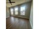 Spacious living room is filled with natural light and has beautiful hardwood floors at 970 Bibbs Circle Nw # 12, Atlanta, GA 30318