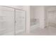 Bathroom featuring a shower with glass doors and a soaking tub at 235 Silver Moon Dr, Loganville, GA 30052