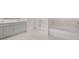 Bright bathroom featuring a double vanity, a shower with glass doors, and a separate soaking tub at 235 Silver Moon Dr, Loganville, GA 30052