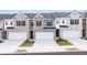 Townhomes with attached garages and small, manicured front yards offer modern living at 235 Silver Moon Dr, Loganville, GA 30052