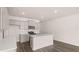 Well-lit kitchen featuring island, stainless steel appliances, and sleek cabinetry at 235 Silver Moon Dr, Loganville, GA 30052