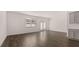 Spacious living room with hardwood floors, large windows and access to the patio at 235 Silver Moon Dr, Loganville, GA 30052