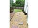Stone pathway alongside a home, leading to a backyard with a privacy fence at 3824 Smith Creek Ct, Buford, GA 30519