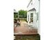 Backyard patio featuring outdoor seating and landscaped views of the yard at 3824 Smith Creek Ct, Buford, GA 30519