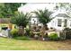 Backyard patio with a gazebo, outdoor furniture, and lush landscaping, perfect for outdoor relaxation and entertaining at 3824 Smith Creek Ct, Buford, GA 30519