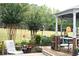 Backyard view from patio, gazebo, outdoor furniture, and lush landscaping, perfect for relaxing and outdoor entertainment at 3824 Smith Creek Ct, Buford, GA 30519