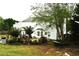 Spacious backyard with a patio area, gazebo, hammock, and lush landscaping, offering a serene outdoor retreat at 3824 Smith Creek Ct, Buford, GA 30519