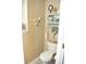 Beach themed bathroom with seashell decor and white toilet at 3824 Smith Creek Ct, Buford, GA 30519
