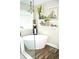 A soaking tub with stylish fixtures is adjacent to a glass-enclosed shower at 3824 Smith Creek Ct, Buford, GA 30519