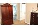 Spacious bedroom featuring armoire, and view of bath at 3824 Smith Creek Ct, Buford, GA 30519
