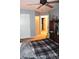 Inviting bedroom with a ceiling fan, closet access, and neutral-toned carpet at 3824 Smith Creek Ct, Buford, GA 30519