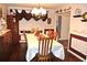 Traditional dining room with wood floors, chandelier, and decorative wall accents for elegant dinners at 3824 Smith Creek Ct, Buford, GA 30519
