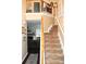 Inviting foyer with staircase and view into the living room with a fireplace at 3824 Smith Creek Ct, Buford, GA 30519