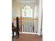 Hallway with carpeted floor and white railing at 3824 Smith Creek Ct, Buford, GA 30519