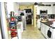 Kitchen features stainless steel refrigerator, white cabinets and mosaic backsplash at 3824 Smith Creek Ct, Buford, GA 30519