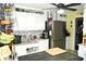 Kitchen features a black refrigerator, white cabinets, and a breakfast bar countertop at 3824 Smith Creek Ct, Buford, GA 30519