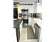 Modern kitchen featuring stainless steel appliances, white cabinetry, and stylish countertops at 3824 Smith Creek Ct, Buford, GA 30519