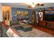 Spacious living room featuring a comfortable sectional, hardwood floors, and stylish decor at 3824 Smith Creek Ct, Buford, GA 30519