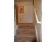 Carpeted staircase with a white handrail leads to the next level at 3824 Smith Creek Ct, Buford, GA 30519