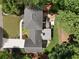 Aerial view of a house with a large yard, patio, and hot tub surrounded by mature trees at 4249 Arbor Club Dr, Marietta, GA 30066