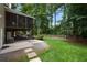 Outdoor space featuring a covered patio, lush lawn, and access to backyard, offering a relaxing retreat at 4249 Arbor Club Dr, Marietta, GA 30066