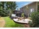 Spacious backyard with a lush lawn, patio seating area, and a relaxing hot tub, ideal for outdoor living at 4249 Arbor Club Dr, Marietta, GA 30066