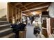 Unfinished basement with exposed ceiling and a carpeted staircase and floor at 4249 Arbor Club Dr, Marietta, GA 30066