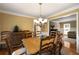 A view of the dining room, hardwood floors, chandelier, and easy access to the living room at 4249 Arbor Club Dr, Marietta, GA 30066