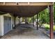 Backyard with covered carport leading to a hot tub and a lush yard at 4249 Arbor Club Dr, Marietta, GA 30066