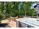 Relaxing hot tub with outdoor seating area and backyard views, perfect for unwinding and enjoying nature at 4249 Arbor Club Dr, Marietta, GA 30066