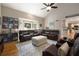 Spacious living room with vaulted ceilings, hardwood floors, and comfortable leather seating at 4249 Arbor Club Dr, Marietta, GA 30066