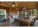 Relaxing screened-in porch with comfortable seating, ceiling fans, and wood finishes, perfect for entertaining at 4249 Arbor Club Dr, Marietta, GA 30066