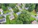 Overhead view of property situated among mature trees in a neighborhood at 536 Cherokee Overlook Court Ct, Canton, GA 30115